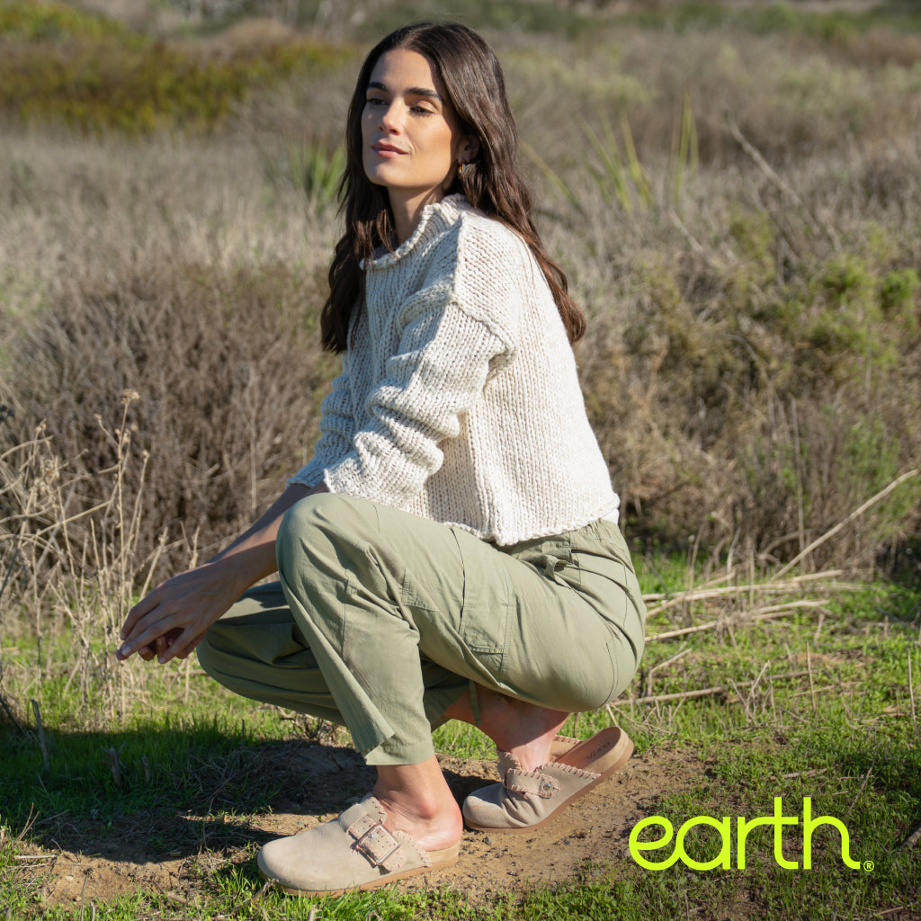 Model wearing Earth Shoes clogs in tan