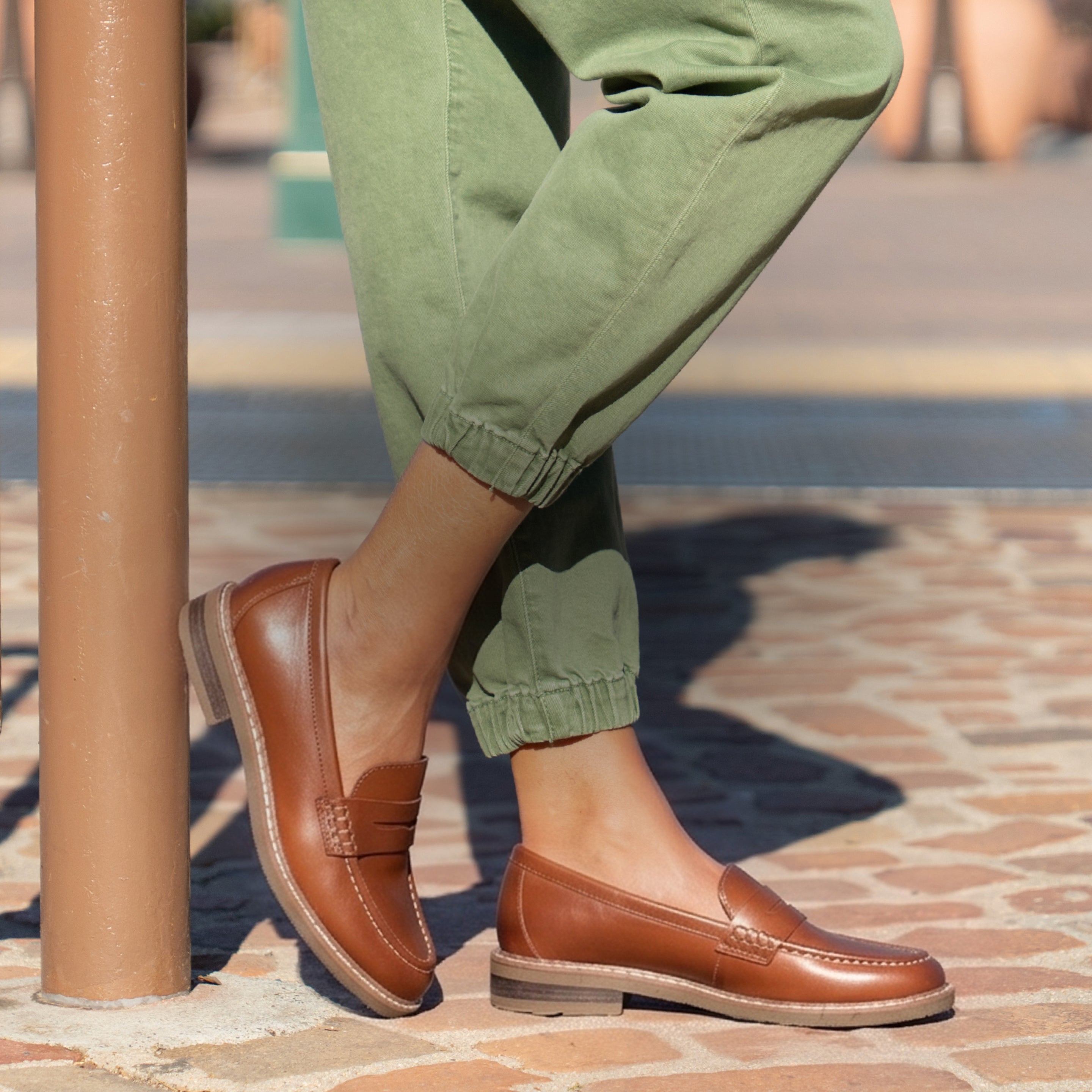 Model wearing Earth Shoes loafers in brown
